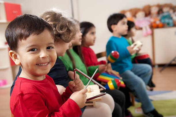 Little boys portrait.A group of preschool children in a music class.